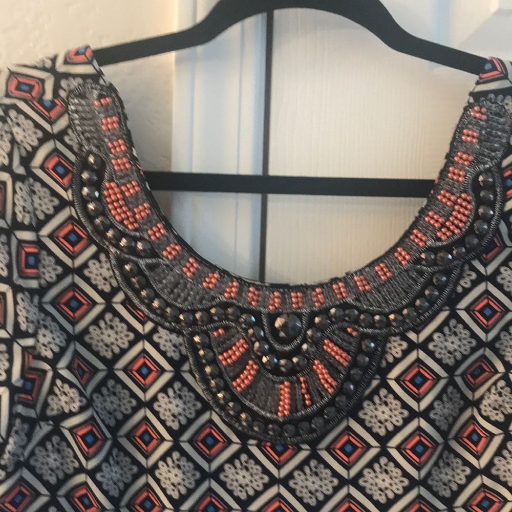 Patterned dress with beaded front